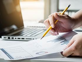 business managers working with new startup in modern loft.Analyze reports,plans